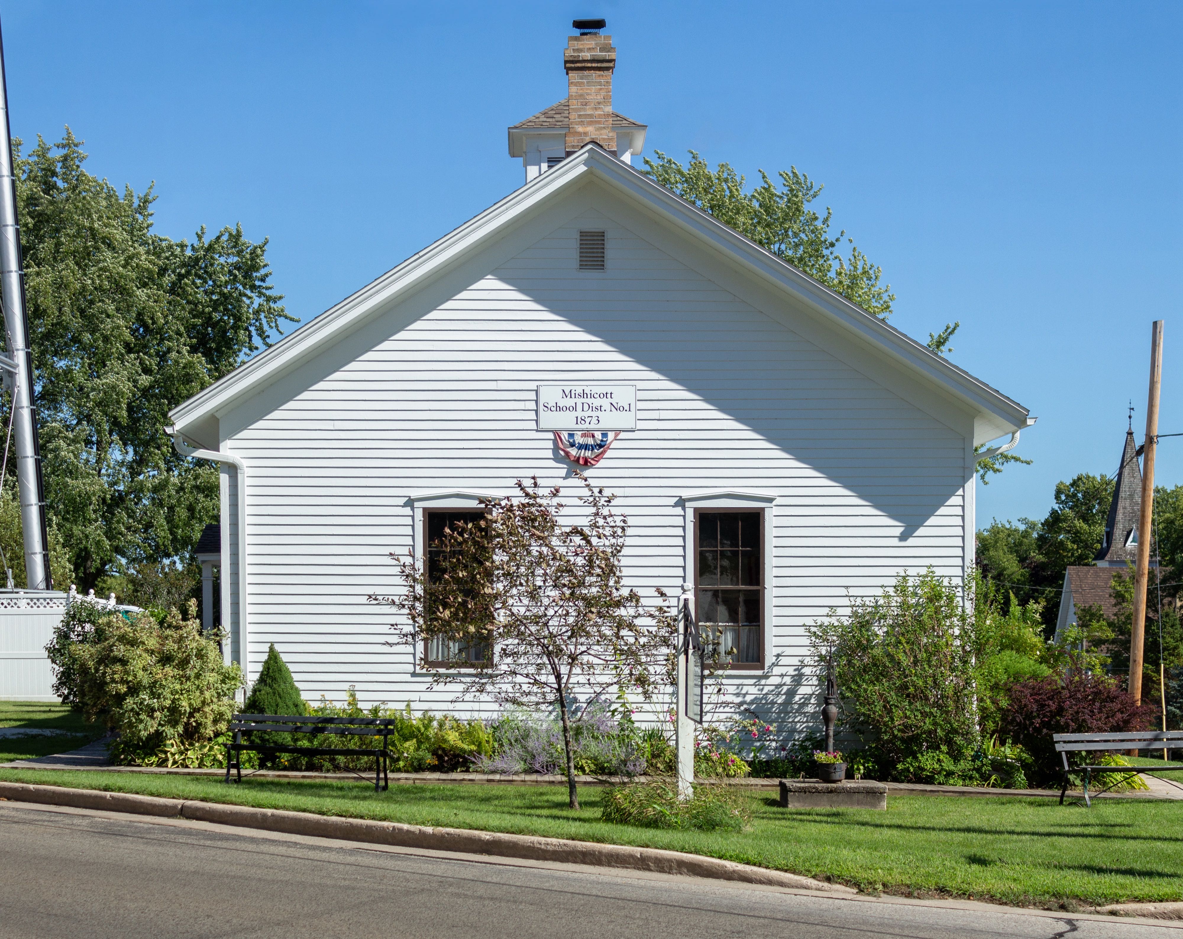 A side view of the Mishicot Historical Museum.